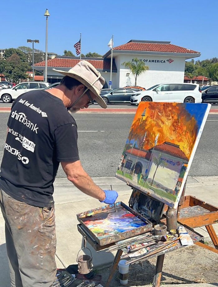 Painter capturing a scene of a bank with an unusual twist, making observers go 'Hmmm' in curiosity. Painter capturing a scene of a bank with an unusual twist, making observers go 'Hmmm' in curiosity.
