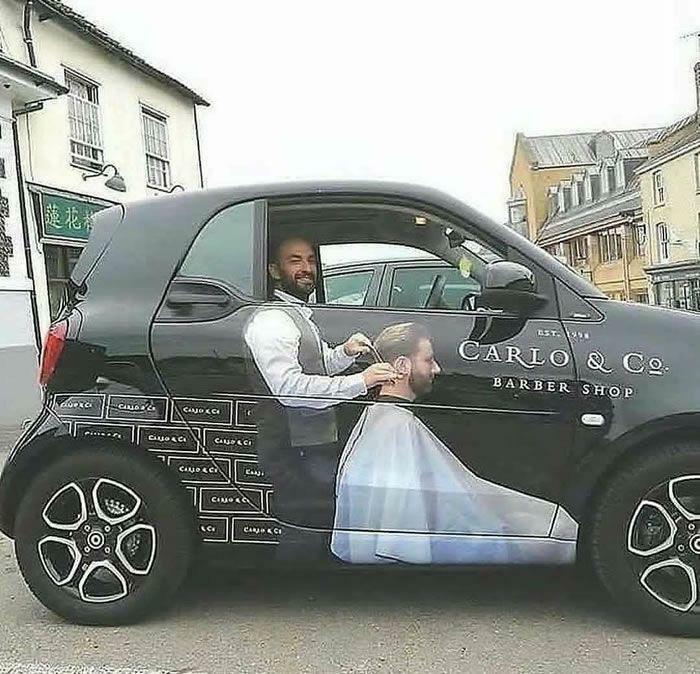 Barber shop car wrap creates optical illusion of a man getting a haircut, making viewers go 'hmmm'. Barber shop car wrap creates optical illusion of a man getting a haircut, making viewers go 'hmmm'.