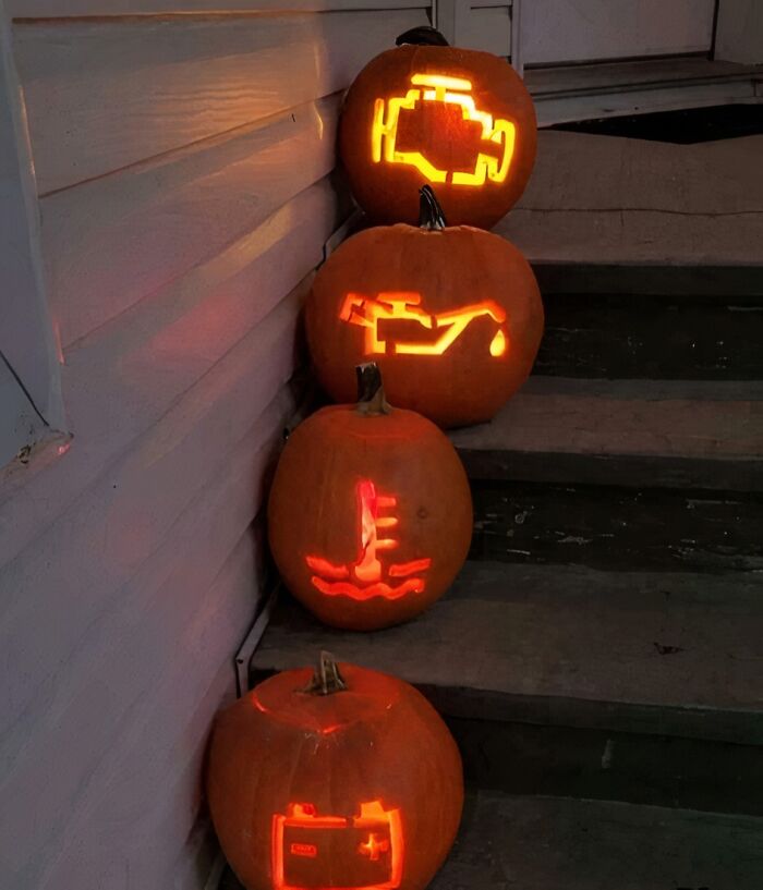 Pumpkins on steps carved with car warning lights, capturing a 'hmmm' moment. Pumpkins on steps carved with car warning lights, capturing a 'hmmm' moment.
